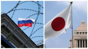 Прапор РФ за колючим дротом поряд з прапором Японії на тлі санкцій