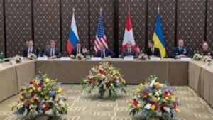 Переговори делегацій України та РФ за столом за участю США та Канади