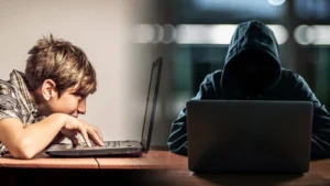 Підліток і хакер за ноутбуками символізують небезпеку в інтернеті